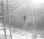 Sam Dixon tightrope walking beside the Cantilever Bridge