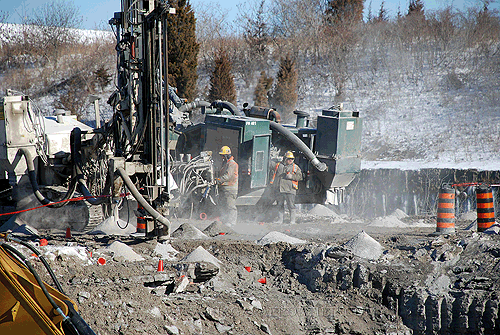 Castonguay Blasting Crew drilling on rock plug