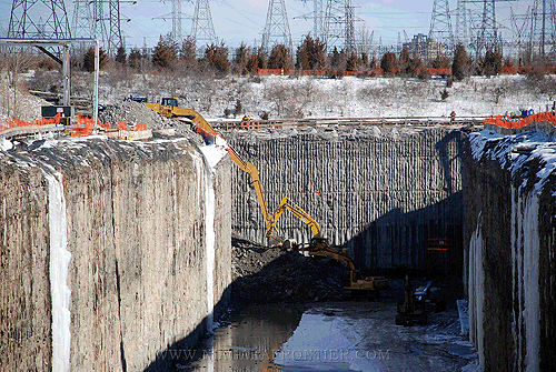 Clearing rock debris from Outlet Channel at Rock Plug