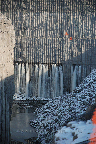 Outlet channel rock plug separating hydro feeder canal